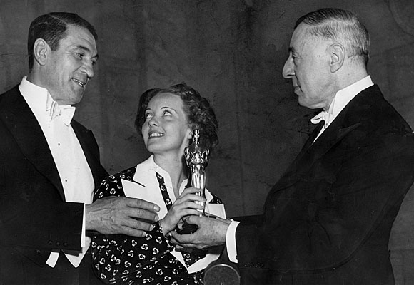 Bette Davis, center, with Victor McLaglen, left, and D.W. Griffith