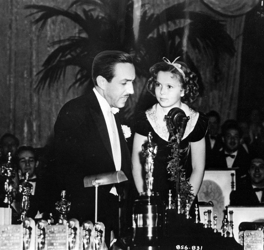 Shirley Temple, 9, presents Walt Disney with a special Oscar.