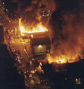 Aerial view of fires burning out of control in the vicinity of Vermont and Vernon avenues. (April 29, 1992)