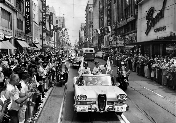 April 18, 1958: Spectators line Broadway as Dodgers Manager Walter Alston, right, and coach Charlie Dressen