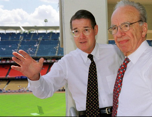 Former Los Angeles Dodgers owner Peter O'Malley, left, and new owner Rupert Murdoch look over the playing field during Opening Day in 1998.