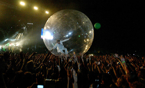 Wayne Coyne of the Flaming Lips rolls over the crowd.