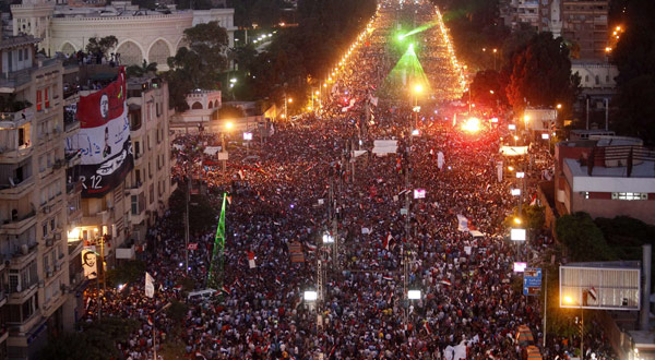 Hundreds of thousands of Egyptian demonstrators gather outside the presidential palace in Cairo during a protest.