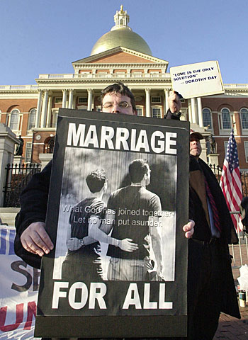 A supporter of gay marriage holds a sign outside the Massachusetts State House.