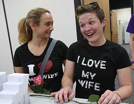 Alicia Atkinson, left, and Laurin Fabry, right, convert their civil union to a marriage license at the DuPage County Clerk's office in Wheaton, Ill.
