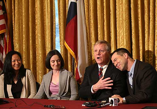 Couples, from left, Cleopatra De Leon and Nicole Dimetman, and Mark Phariss and Victor Holmes, give a news conference in San Antonio after U.S.  Judge Orlando Garcia's ruling.