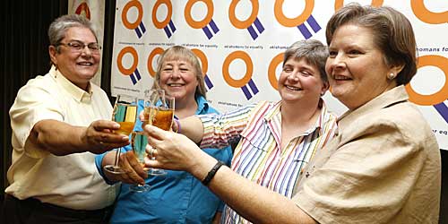 Plaintiffs Sue Barton, her partner Dr. Gay Phillips, Sharon Baldwin, and her partner Mary Bishop have a champagne toast during a celebration of a decision by the 10th Circuit Court of Appeals. 