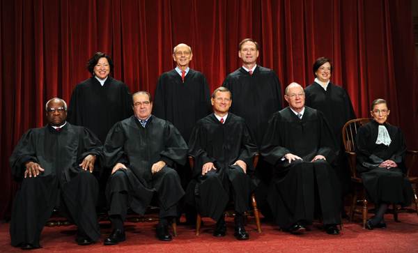 The Supreme Court justices sit for their official photograph in 2010. Seated from left are: Associate Justices Clarence Thomas, Antonin Scalia, Chief Justice John Roberts, Associate Justices Anthony M. Kennedy and Ruth Bader Ginsburg. Standing from left are: Associate Justices Sonia Sotomayor, Stephen Breyer, Samuel Alito Jr. and Elena Kagan.

