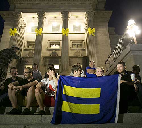 Same-sex marriage supporters gather on the steps of the Idaho Statehouse in Boise after U.S. Magistrate Judge Candy Wagahoff Dale ruled that Idaho's ban on gay marriage is unconstitutional.