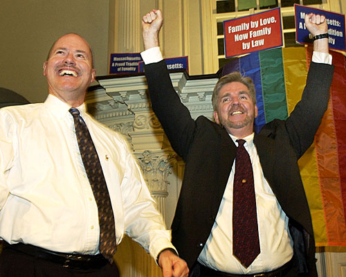 Ed Balmelli, left, and Michael Horgan, one of seven gay couples who sued the state of Massachusetts, celebrate in Boston.