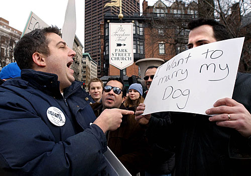 A supporter of gay marriage, left, argues with an opponent outside the statehouse.