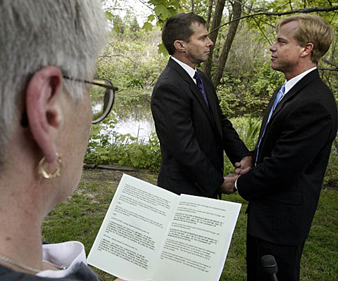 Chris McCary, right, and John Sullivan are married by Justice of the Peace Joan Drysdale in Provincetown, Mass.