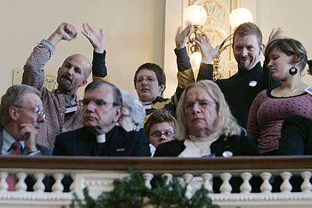 Supporters wave from the gallery as the civil unions bill is debated in the New Jersey Assembly.