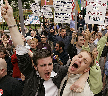 Greg Kimball, left, of Manchester, Mass., and his partner, Brian O'Connor, celebrate after Massachusetts lawmakers blocked a statewide vote to ban same-sex marriage.