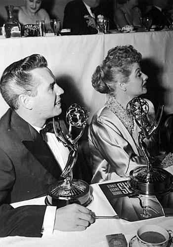 Lucille Ball and her husband, Desi Arnaz, attend the Emmys and receive an award for their show, "I Love Lucy." 