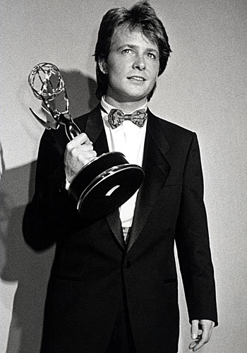 Michael J. Fox shows off his actor award for "Family Ties."