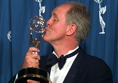 John Lithgow kisses his Emmy.