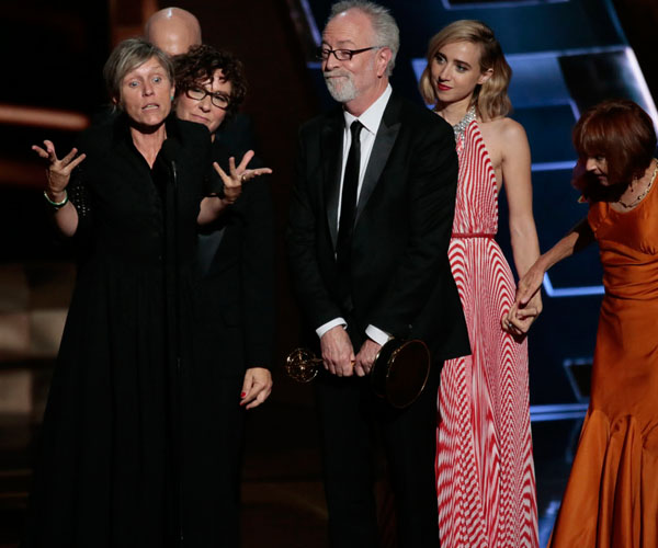 Frances McDormand, left, and other members of the cast and crew of "Olive Kitteridge" accept the limited series award.