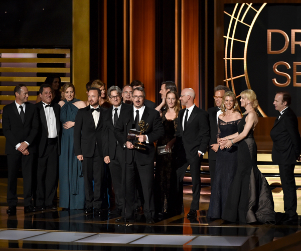 Show creator Vince Gilligan of "Breaking Bad," center, is shown with cast and crew as they accept the Emmy for drama series. 