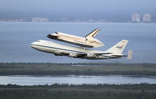 The space shuttle Endeavour rides atop a Boeing 747 after taking off from Kennedy Space Center on Wednesday.