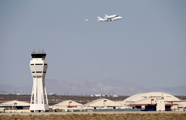 The space shuttle Endeavour mounted on NASA's carrier aircraft flies over Edwards Air Force Base on Thursday.
