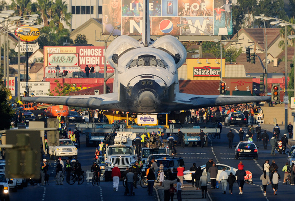 The space shuttle Endeavour is transported to The Forum arena for a stopover and celebration on its way to the California Science Center on Saturday. 