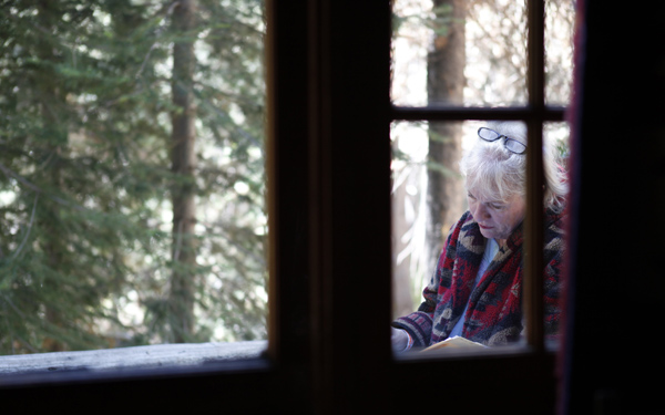 Mary Breckenridge prepares for her trans–Sierra trip at her cabin in Lake Huntington.