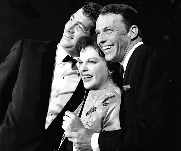 Judy Garland is flanked by Dean Martin, left, and Frank Sinatra in a still from the television concert special "The Judy Garland Show," directed by Norman Jewison.