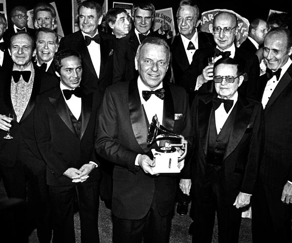 Frank Sinatra is honored by celebrity friends Paul Anka, Glenn Ford, Phil Harris, Rich Little, Red Skelton, Julie Styne, Dean Martin, Dina Merrill and Henry Mancini in 1979.