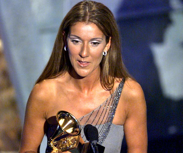 Celine Dion accepts her Grammy for record of the year at the 41st Grammy Awards in Los Angeles.