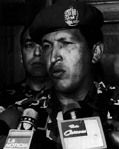 Leader of the Bolivarian Revolution 2000, Hugo Chavez, talks to reporters at the Defense Ministry after he surrendered to the troops loyal to Carlos Andres Perez.