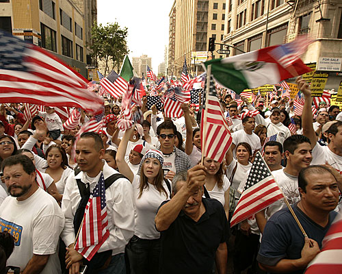 Immigrants and supporters gather at Olympic Boulevard and Broadway in one of two Los Angeles marches that attracted hundreds of thousands of demonstrators.