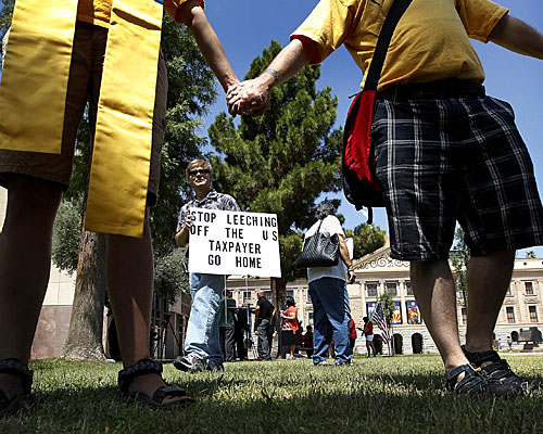 Supporters of the get-tough effort on illegal immigration demonstrate at the Arizona Capitol. 