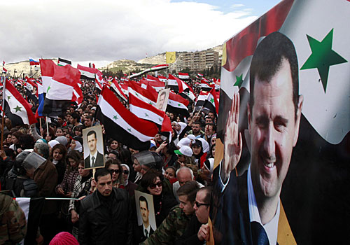 Throngs turn out in support of President Bashar Assad at Umayyad Square in Damascus, the capital. Pro-Assad rallies were also held in other cities. 