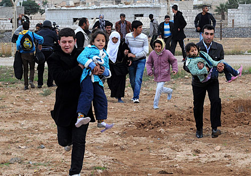 Amid violence near the Turkish border, 8,000 people fled the northeastern city of Ras Ayn alone. How far will this go? asked Turkey's prime minister.