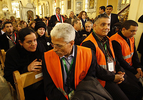 Arab League observers, in front row, attend a Mass in Damascus this month for Syrian victims.