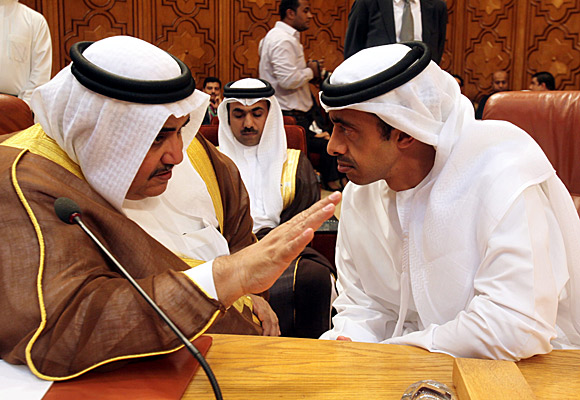Bahraini Foreign Minister Sheik Khalid bin Ahmed al Khalifa, left, consults with his UAE counterpart Sheik Abdullah bin Zayed al Nahyan.