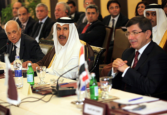 Arab League Secretary General Nabil Alarabi, left, and Qatari Foreign Minister Hamad bin Jasim, center, and Turkey's Foreign Minister Ahmet Davutoglu, right.