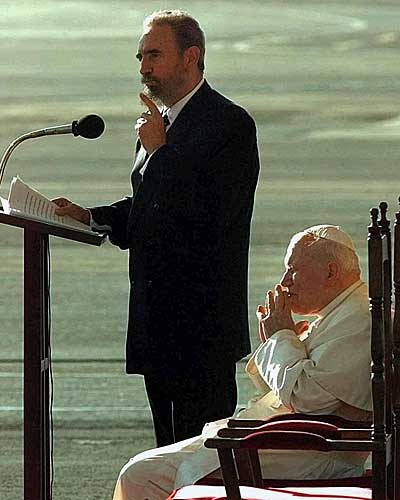 Pope John Paul II listens as Fidel Castro makes speaks of Jan. 21, 1998, during a welcoming ceremony at Jose Marti Airport in Havana. 