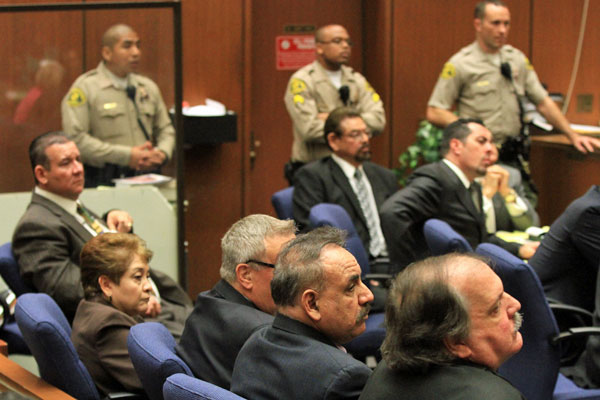 From lower right are Victor Bello, Oscar Hernandez, George Cole, Teresa Jacobo, Luis Artiga and George Mirabal. Luis Artiga, the only of the six defendants who was acquitted on all charges, was released by the judge.