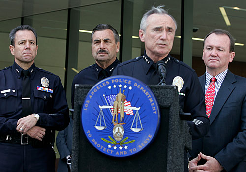 Police Chief William J. Bratton addresses the media in his final new conference in front of the new Police Administration Building. Left to right: Deputy Chief Michel Moore, Deputy Chief Charlie Beck and Assistant Chief Jim McDonnell. (Oct. 28, 2009)