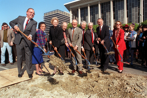 Architect Frank Gehry, third from right, turns a shovel of dirt at the groundbreaking for Walt Disney Concert Hall.