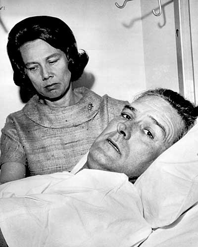 Connally with his wife, Nellie, at his bedside at Parkland Hospital in Dallas, describes the attack on the presidential motorcade. (Nov. 28, 1963)