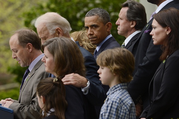 President Obama looks on during a blistering critique of Washington's inaction on gun control.