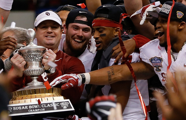 Oklahoma Coach Bob Stoops, left, celebrates with his players following the Sooners' 45-31 upset victory over two-time defending BCS champions Alabama at the Sugar Bowl.