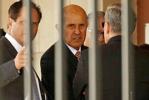 Former Los Angeles County Sheriff Lee Baca leaves federal court via a loading dock.