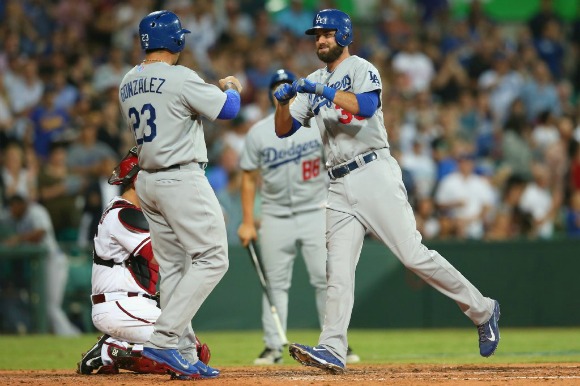 Scott Van Slyke is greeted by Adrian Gonzalez after his two-run homer.