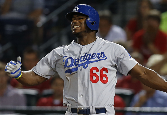 Yasiel Puig reacts as he strikes out during the ninth inning of the Dodgers' 3-2 loss to the Atlanta Braves.