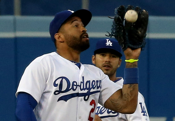 Dodgers left fielder Matt Kemp makes a catch in front of teammate Andre Ethier during a 1-0 win over the St. Louis Cardinals.