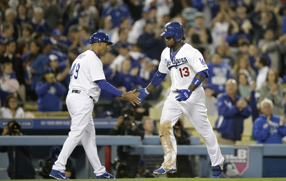 Hanley Ramirez is congratulated by third-base coach Lorenzo Bundy after hitting a solo homer in the 5-2 win.